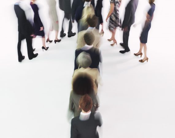Group of Businesspeople Making Arrow